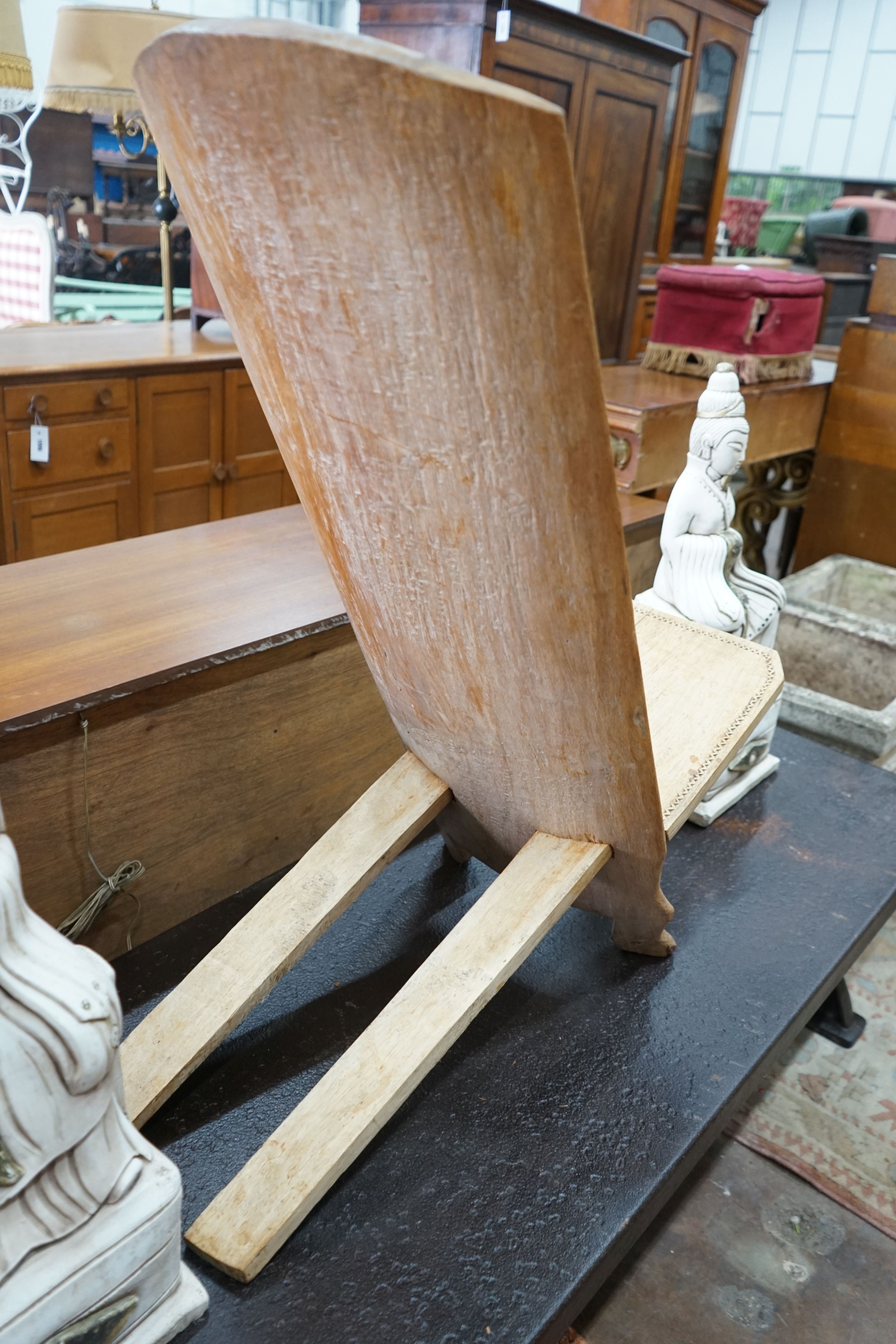 An African chip carved hardwood seat, height 90cm
